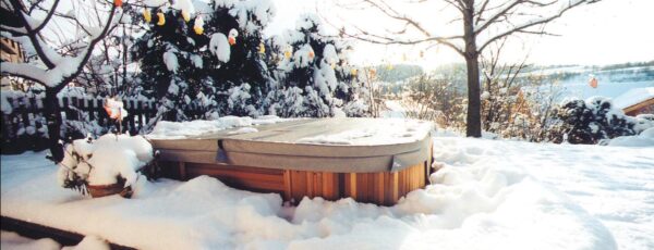 snow covered winter hot tub
